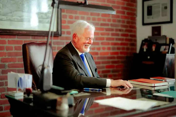 Michael Murphy, K.C., working at his desk in Moncton